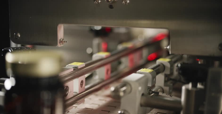 Glass bottles for medicine on a conveyor belt
