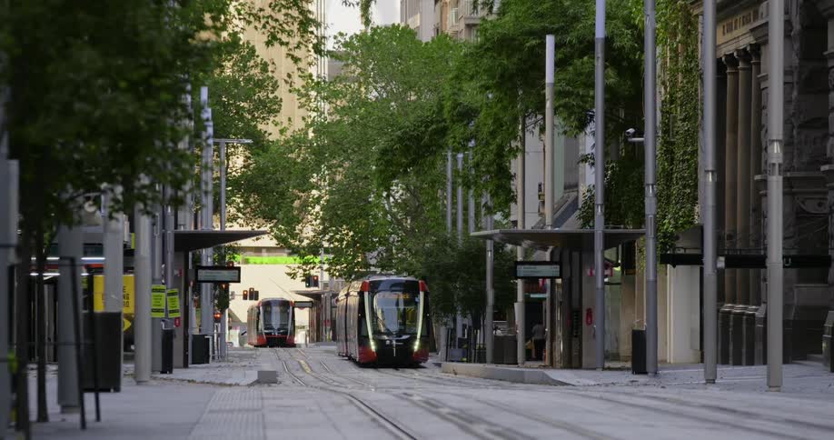 Tram arrives at the station in the city