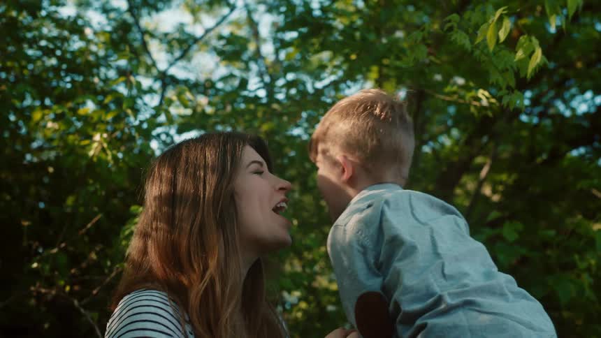 A family have fun by the trees