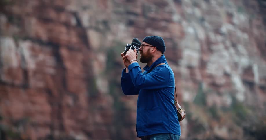 A man is photographing the mountain