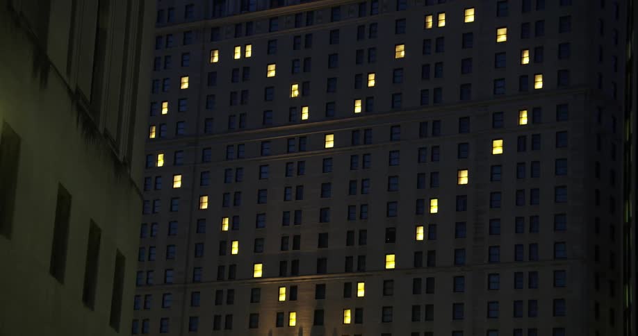 Windows lit up in an apartment building to for a heart