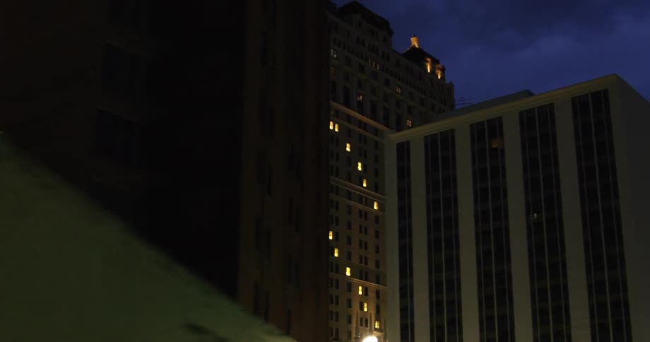 Lights in a high rise building turn on at night and form the shape of a heart