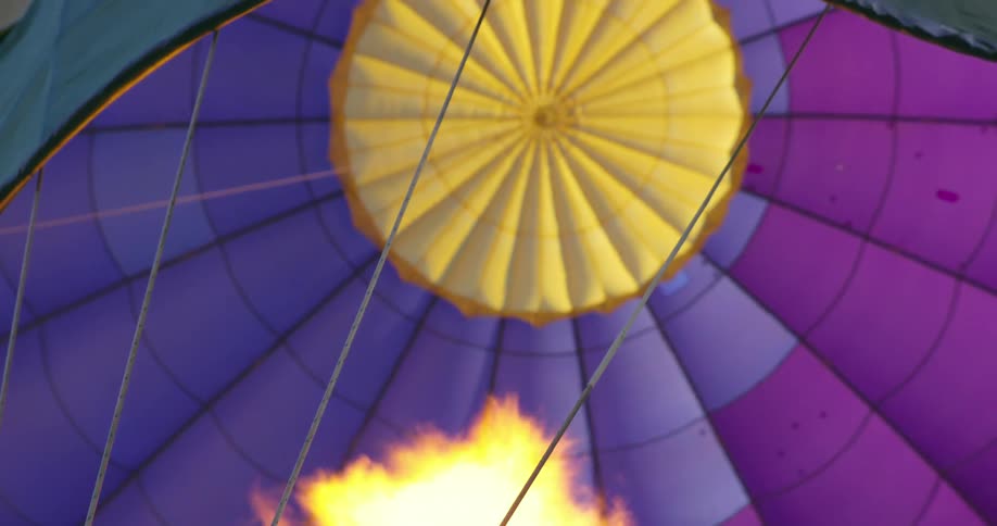 The air in a hot air balloon is heated with flames