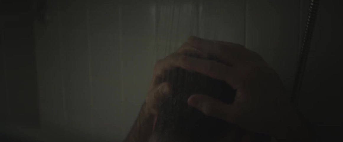 A man is taking a shower