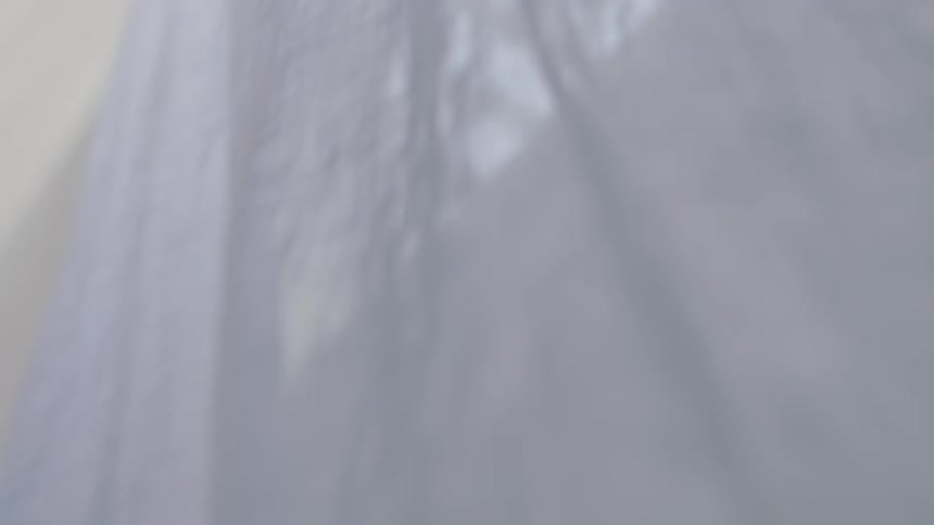 A white cloth flutters in the breeze