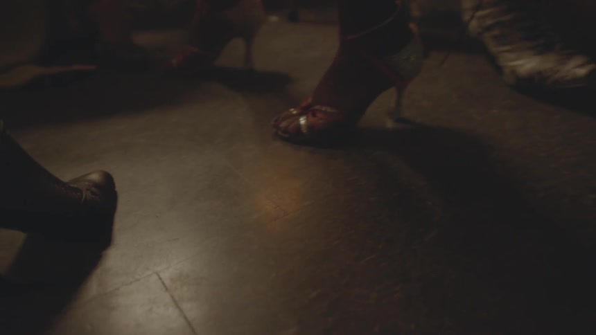 A group of women in fancy shoes sit together