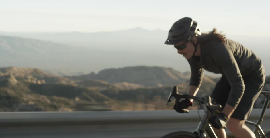 Male cyclist rides a bike on a road