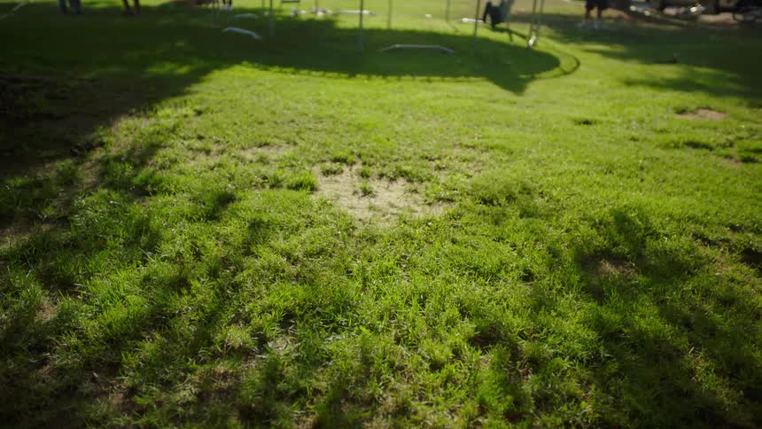 Shadow of a girl jumping on a trampoline in the backyard