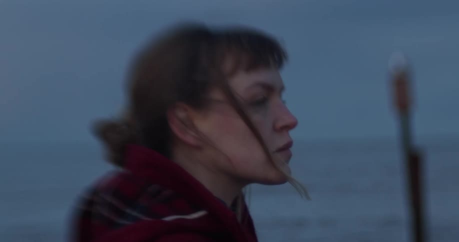 The woman looks over