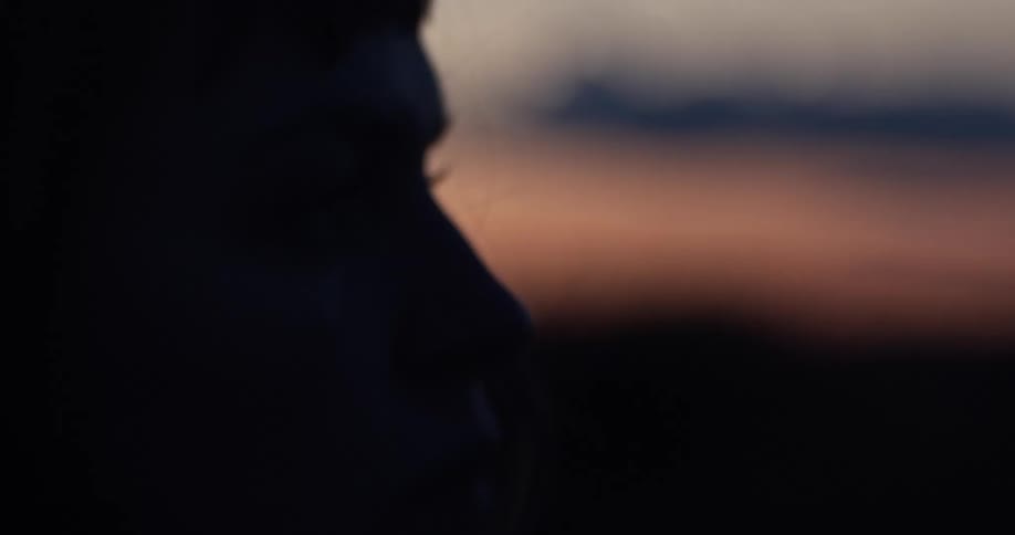 Close up of a person looking off in to the distance