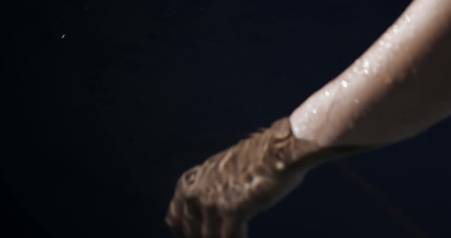 Arm moves into the water