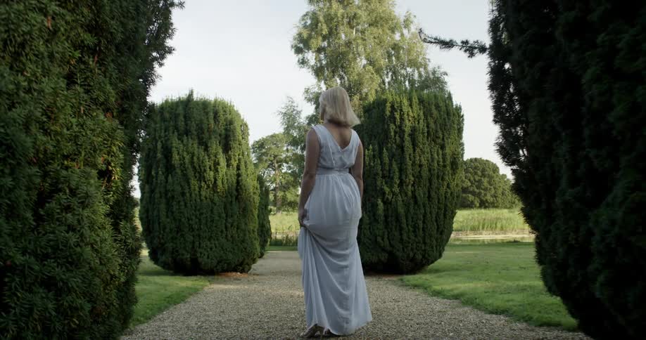 Woman Wearing A white dress in a garden