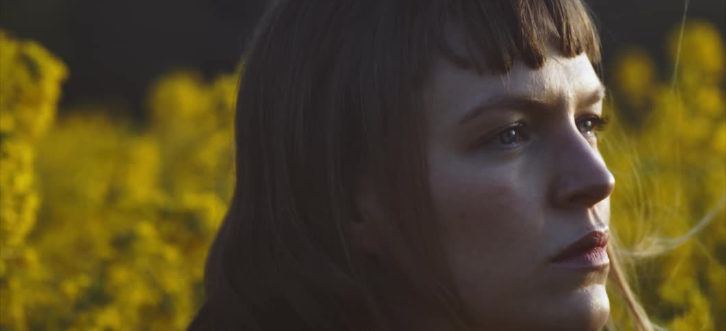 Woman looks around in the field