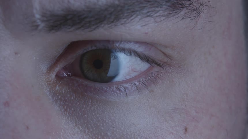 Man opens his eye and looks around