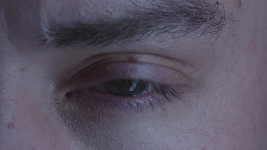 Man opens his eye