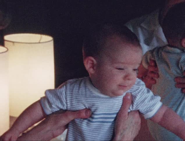 A grandmother dotes on her grandson