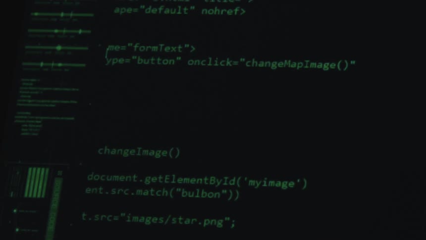 Computer code scrolls by on a monitor