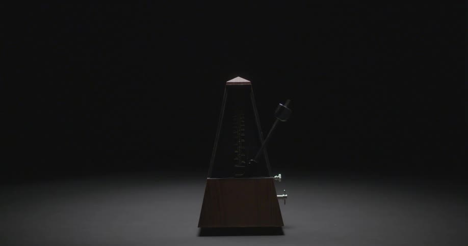 A metronome bounces back and forth