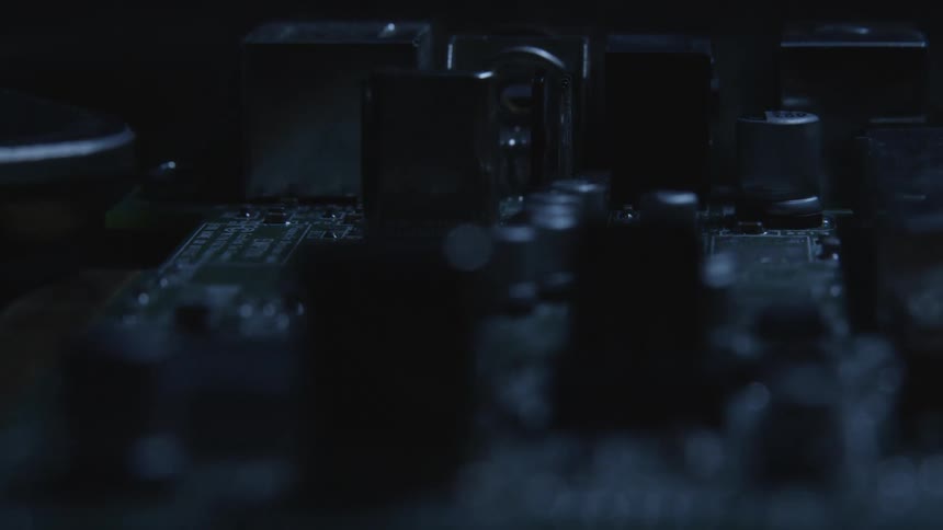 Light shines and reflects off of a circuit board