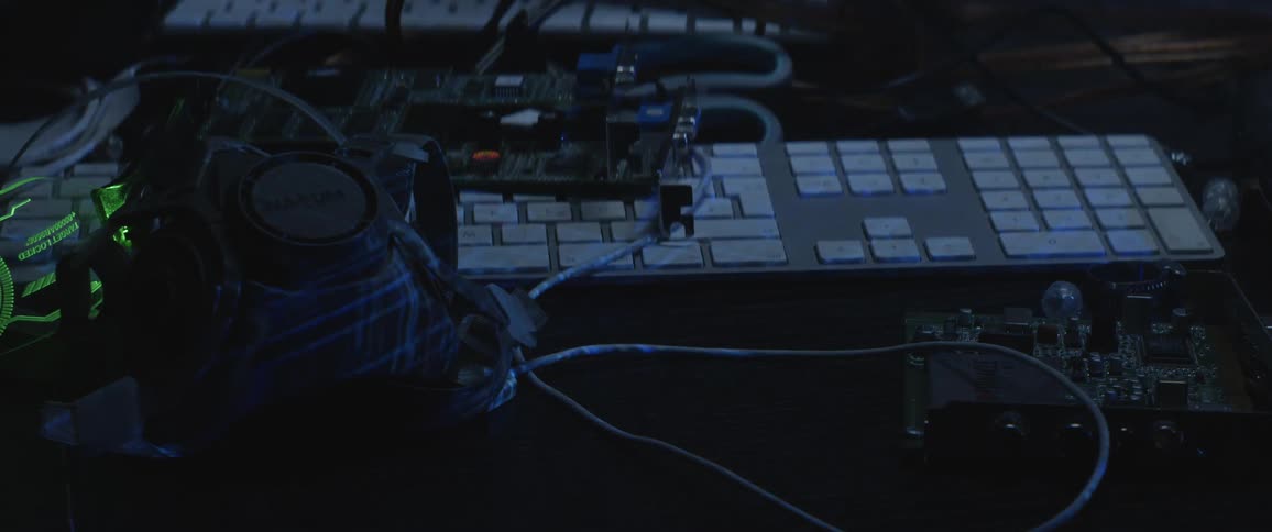 A keyboard and a virtual reality set on a desk