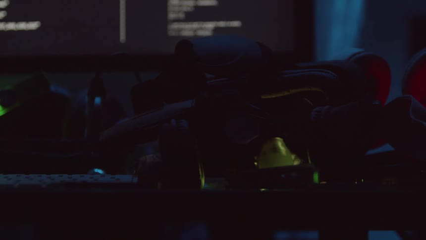 The headphones sit near the computer