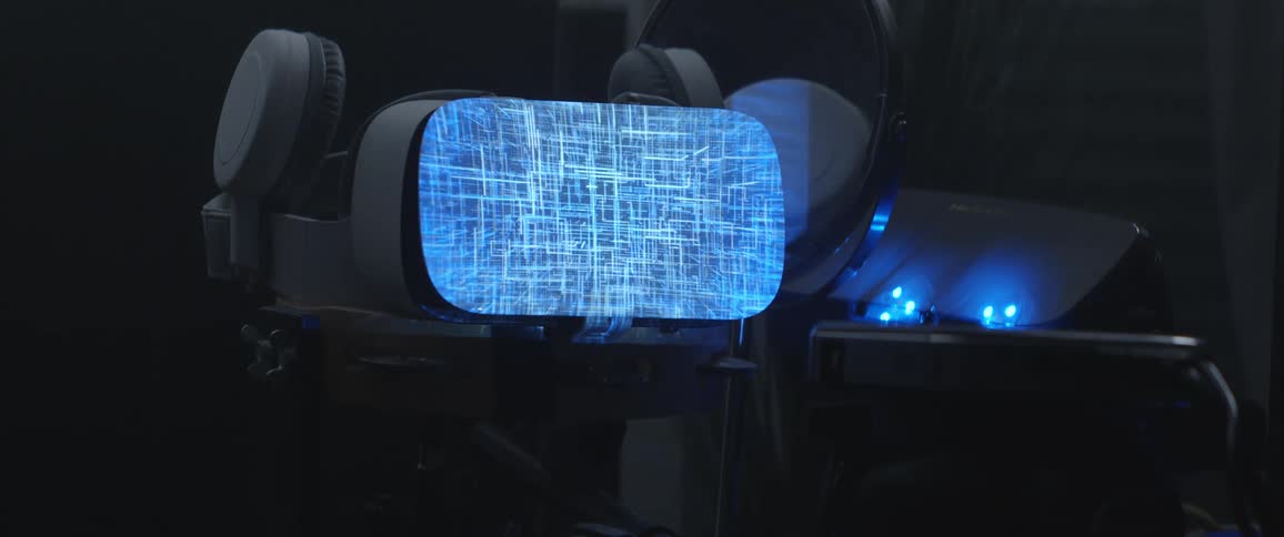 A small computer screen displays light and pattern graphics