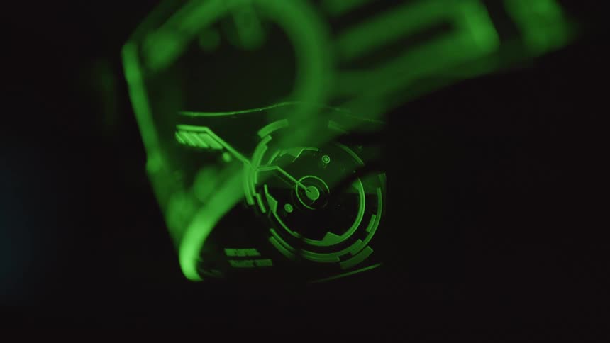 Green round dial sits next to a larger green device