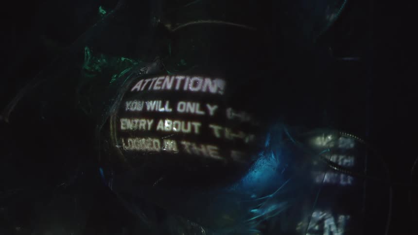 Words and letters projected on a glowing object