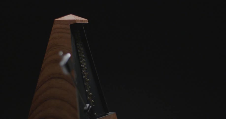 A metronome in a dark room