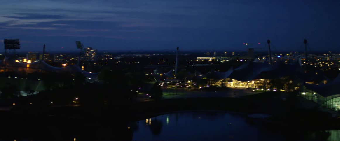 A city skyline is displayed at night
