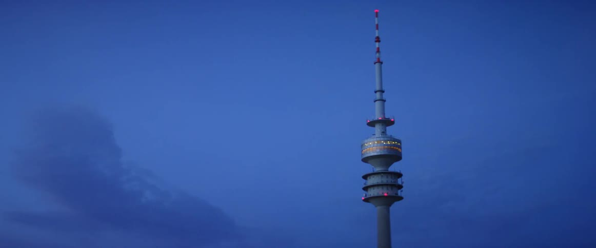 A spire with lights points into the sky