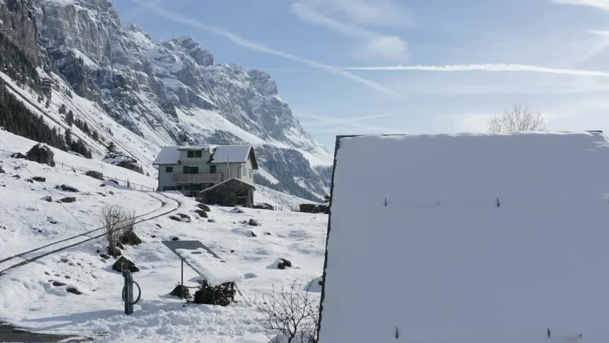 A small village in a valley covered in snow during the winter