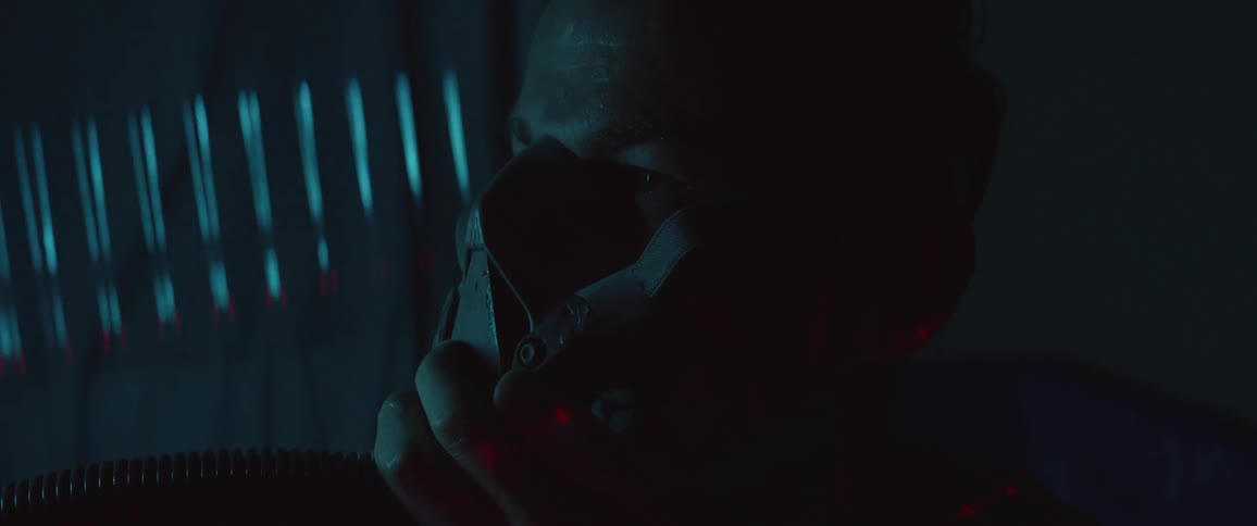 A man with a mask with a hose attached to it