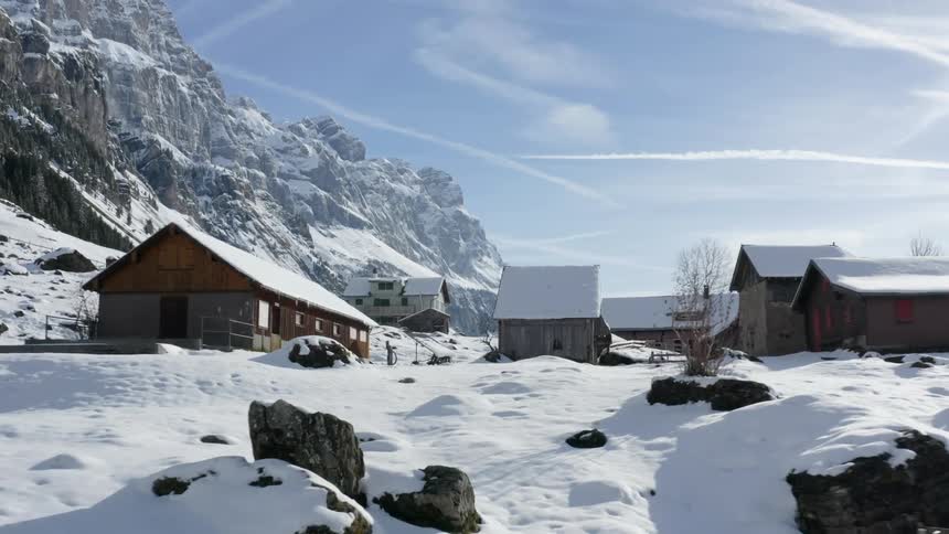 Buildings at the base of a mountain