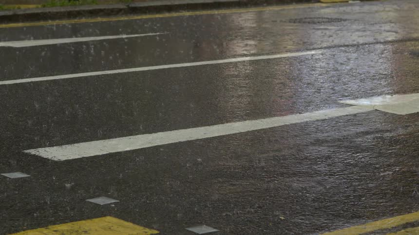 Rain falling on a city street