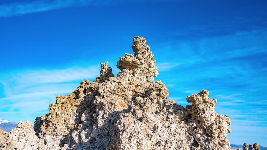 A formation of porous rock sits outdoors