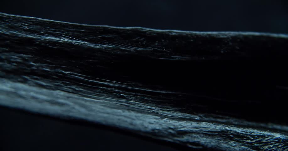Ocean waves roll in the dark night