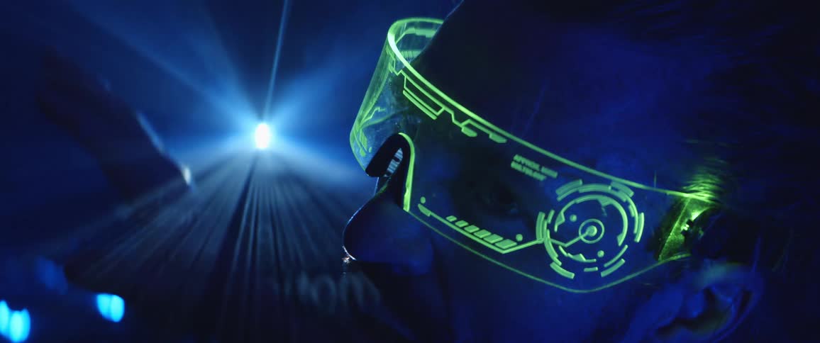 A man wearing futuristic eye wear indoors