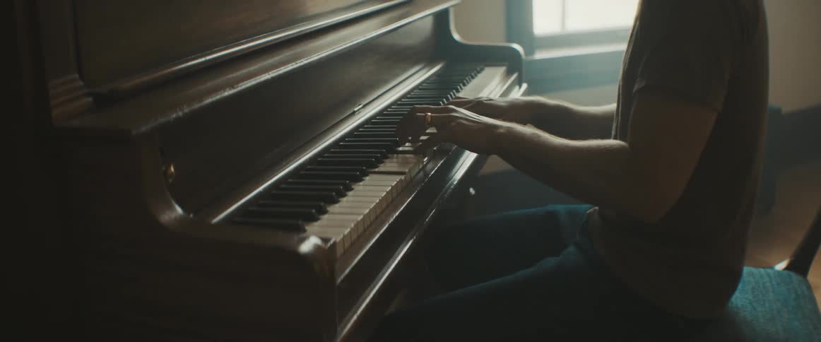 Male pianist plays the piano