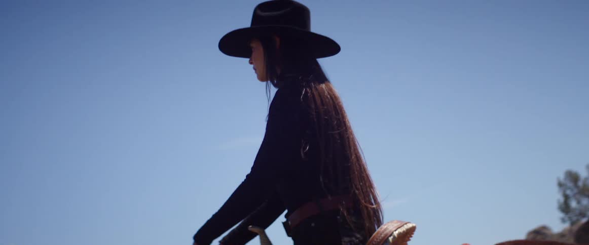 A woman riding her horse