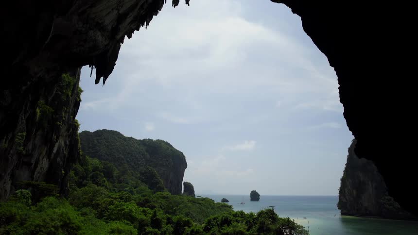 A view of an ocean by mountains is displayed