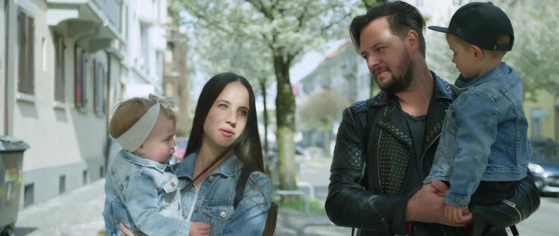 A family walks down the street