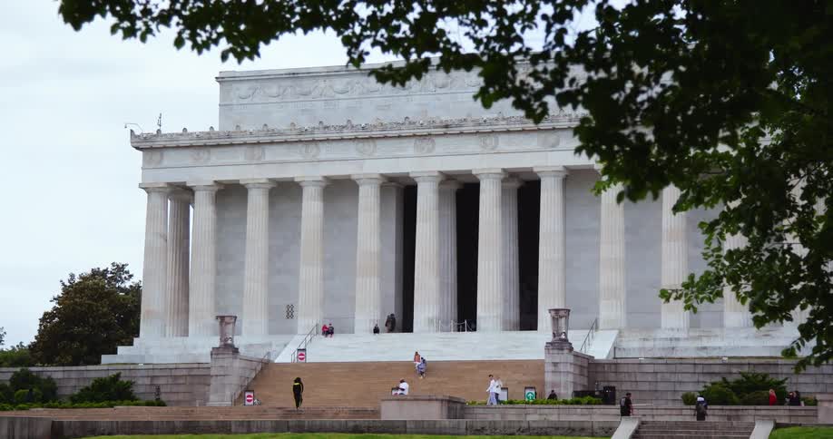 People walk around the Lincoln Memorial