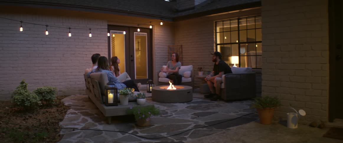 People sit by the fire