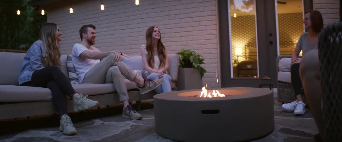A group of friends are hanging out together outdoors