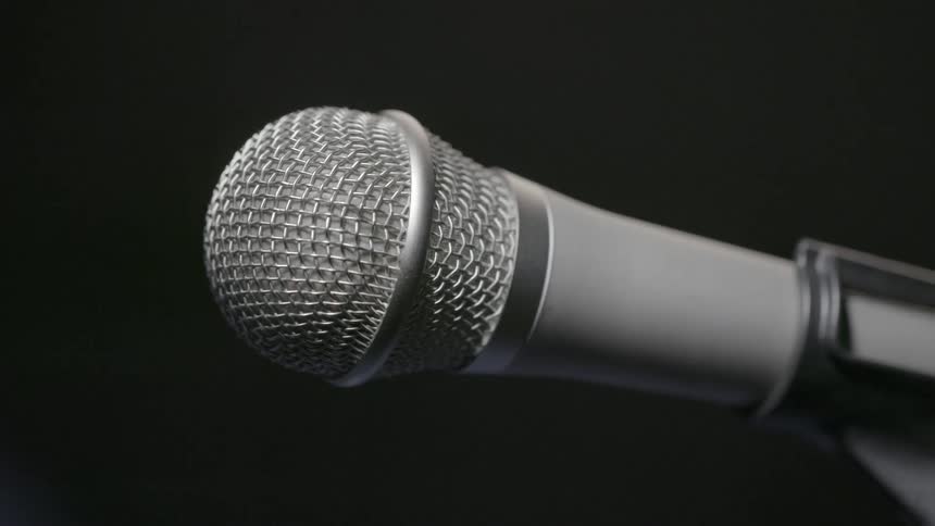 A microphone against a dark background