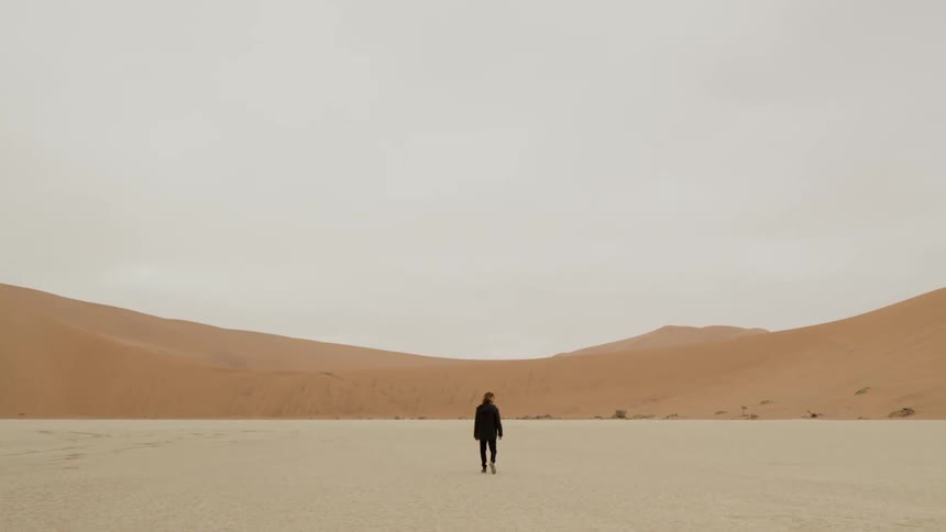 Man walks in the desert
