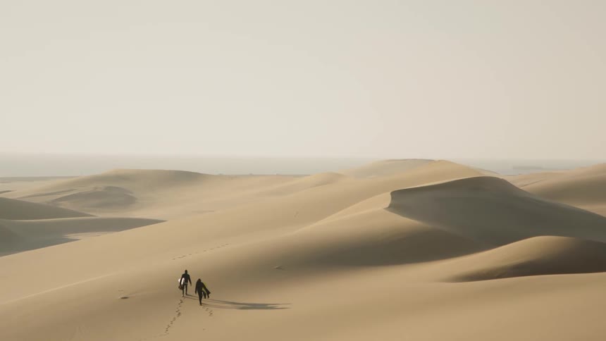 The people walk over the desert