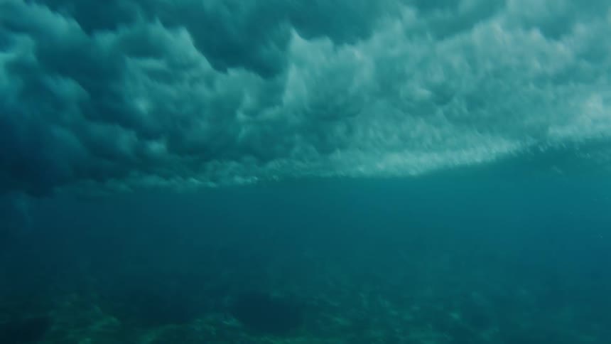 A crashing wave seen from underwater