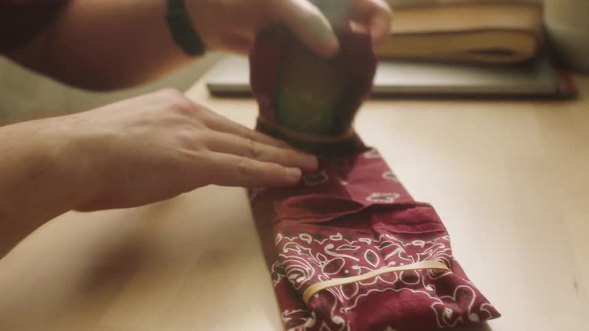 Piece of colored fabric being folded
